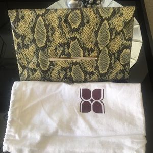 BCBG brand new clutch - snakeskin green and black