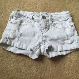 Light wash destroyed jean shorts