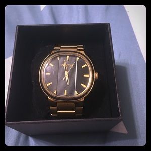 Nixon The Capital in Gold