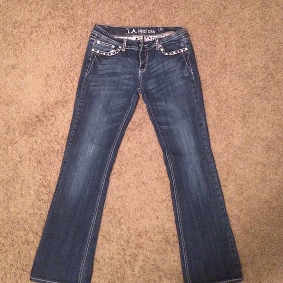 Size 33 LA IDOL used jeans. Faded blue.