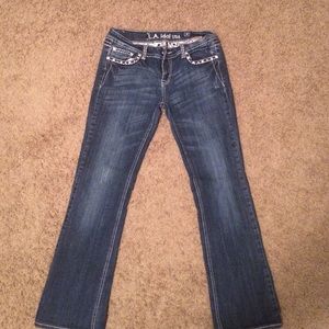 Size 33 LA IDOL used jeans. Faded blue.
