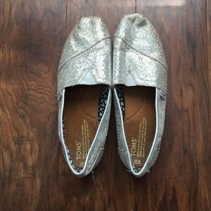 Silver glitter TOMS, size 8.