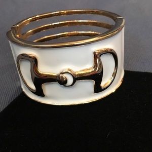 Gold cuff bracelet with porcelain inlay