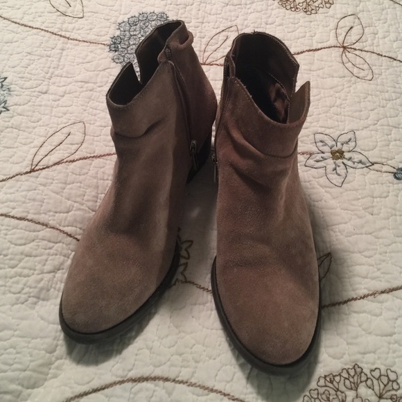 Tan ankle boots with side zipper.