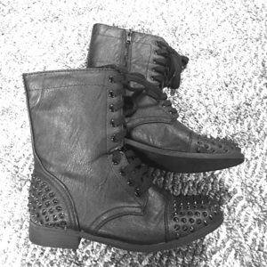 Black studded combat boots.
