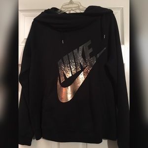 rose gold and black nike shirt