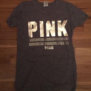 Grey pink shirt with gold title