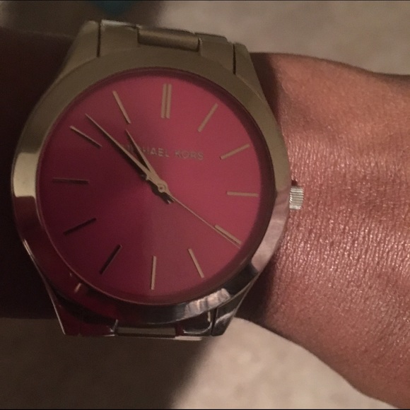 Michael Kors silver watch with pink face.