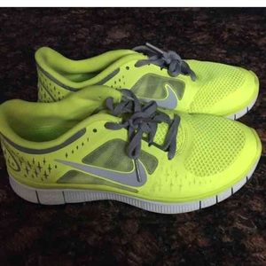 Neon Nike 5.0 tennis shoes