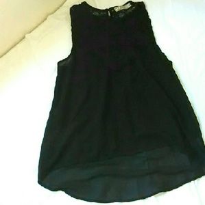 Flowy black tank top lace on top.