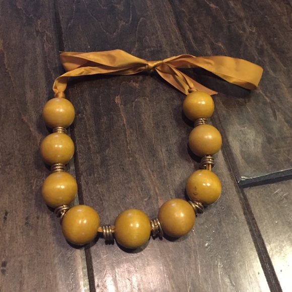 Yellow beaded necklace with ribbon tie in back