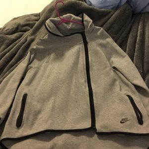 Nike Cape type jacket with hood.