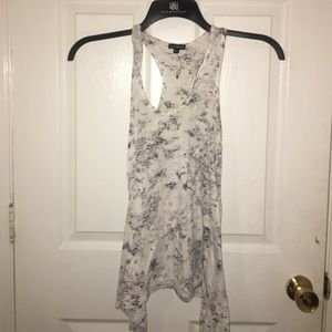 White blouse with a mesh of black/gray spots
