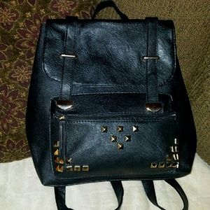 Never used black "leather" back pack