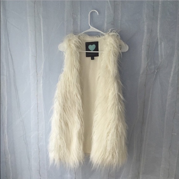 White furry vest!