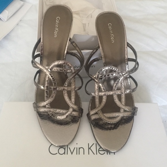 Slip on sparkly high heel sandals.