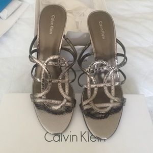 Slip on sparkly high heel sandals.