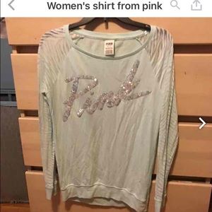Mint colored women's shirt from pink