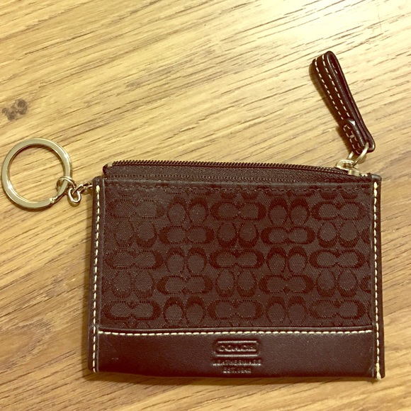 Authentic black Coach change purse.