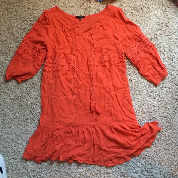 Rust orange flowy dress with ruffle bottom