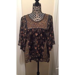 Beautiful flowy top with floral and feather detail