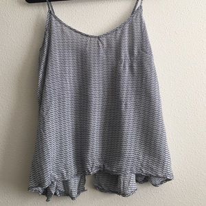 Super cute tank with a button back and open slit
