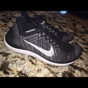 black and white nike flynits