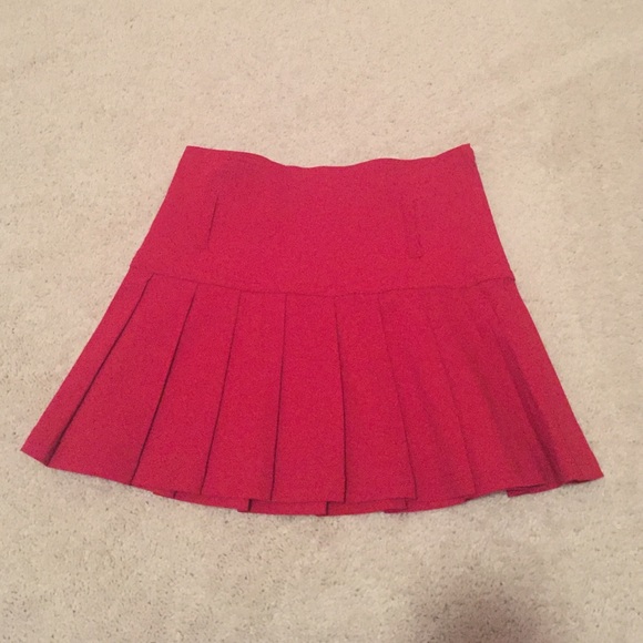 Red pleated mini skirt
