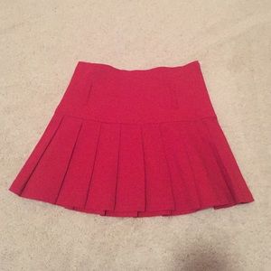Red pleated mini skirt