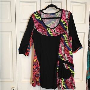 Bright asymmetric tunic