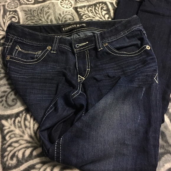 Dark denim wash express jeans size 6R.