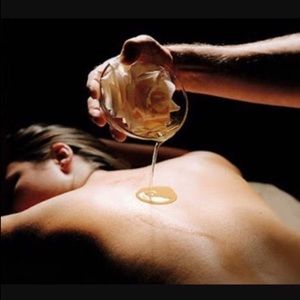 Shimmering body oil candles