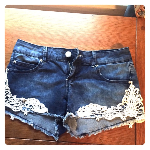 Jean shorts with lace trim on the bottom