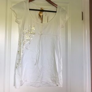 Cute top with gold foil detail.