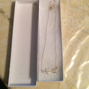 A heart with an arrow necklace
