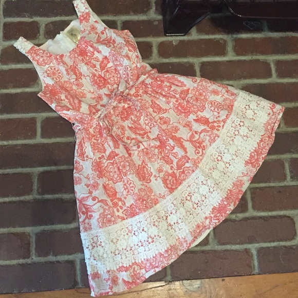 Adorable girls' dress with crocheted detail at hem