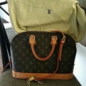 Louis Vuitton Alma monogram handbag