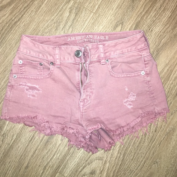 Mid/high rise distressed denim shorts