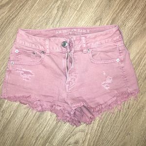 Mid/high rise distressed denim shorts
