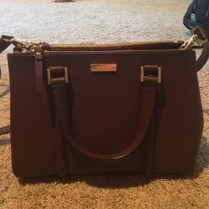 Burgundy Kate Spade shoulder or hand bag.