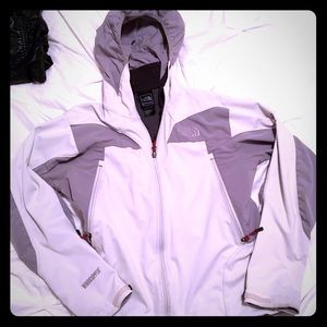 North Face jacket with hood. Lightly discolored.