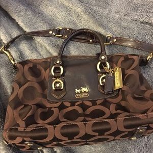 Coach brown canvas with leather trim.