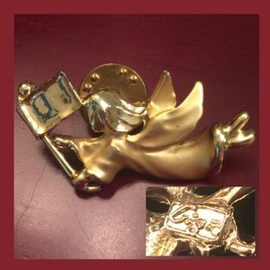 Angle holding a flag, signed by Giusti Gigi