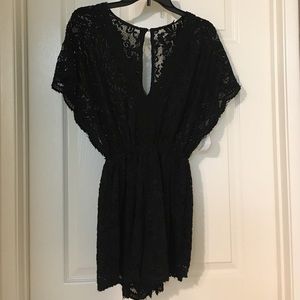 Privately Privileged. Black lace romper