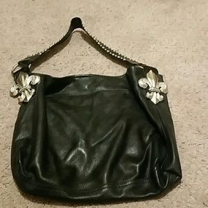 Buttery Leatherrock bag with feur-de-lis detail