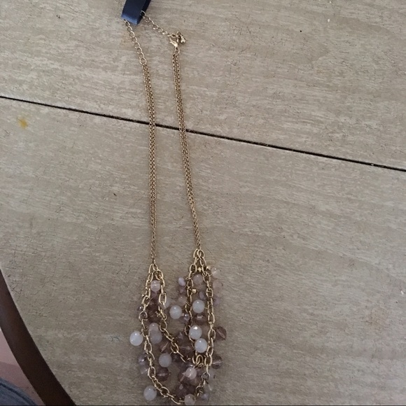 Gold necklace with purple beads