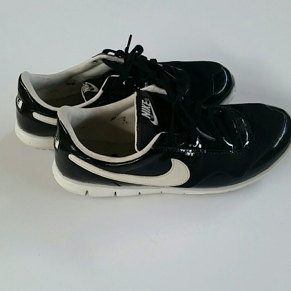 Shiny black Nike shoes