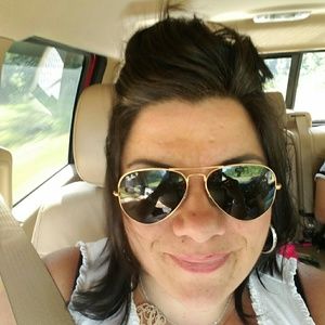 Gold rimmed polarized Ray Ban aviators