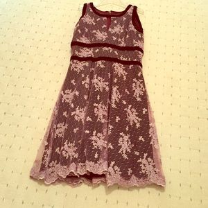 A custom made velvet dress with beaded lace