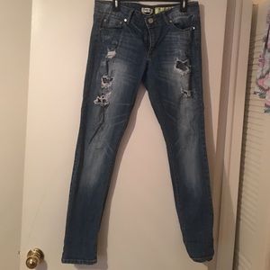 Distressed/ripped skinny jeans.